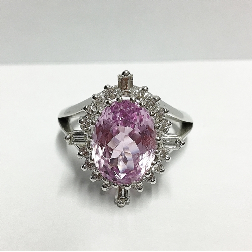 92 - A Kunzite gem set ring with brilliant and baguette diamonds to surround in 18ct white gold