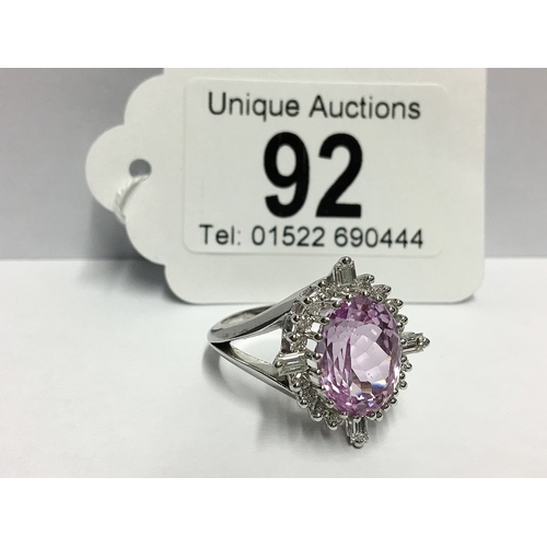 92 - A Kunzite gem set ring with brilliant and baguette diamonds to surround in 18ct white gold