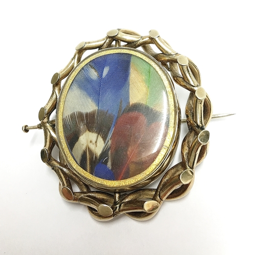 94 - A Victorian mourning brooch with swivel centre of hair and butterfly wings