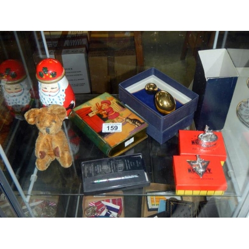 159 - A tin plate money box, 2 Rupert boxed items, Russian Christmas dolls & a Merrythought bear