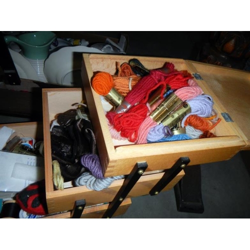 207 - A concertina sewing box & contents