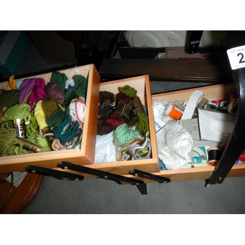 207 - A concertina sewing box & contents