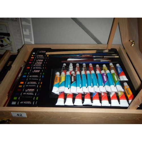 42 - A very good quality 'artists' box, easel, paints, acrylics & pencils etc.