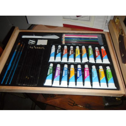 42 - A very good quality 'artists' box, easel, paints, acrylics & pencils etc.