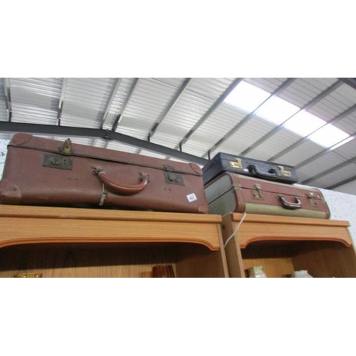 441 - 2 vintage suitcases and a briefcase