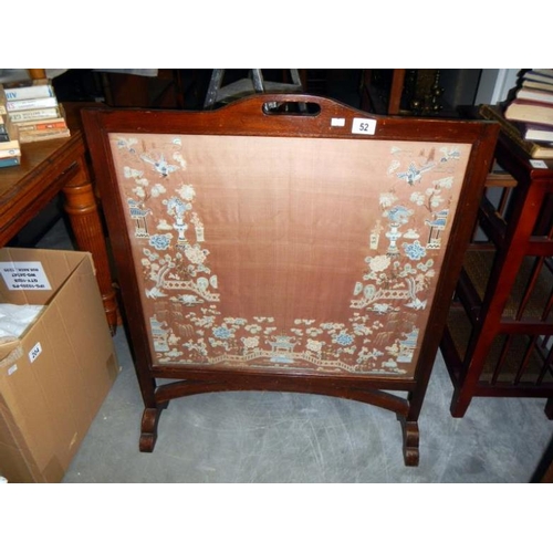 52 - A fire screen with a Chinese silk panel