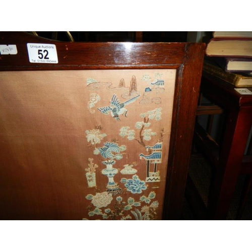 52 - A fire screen with a Chinese silk panel