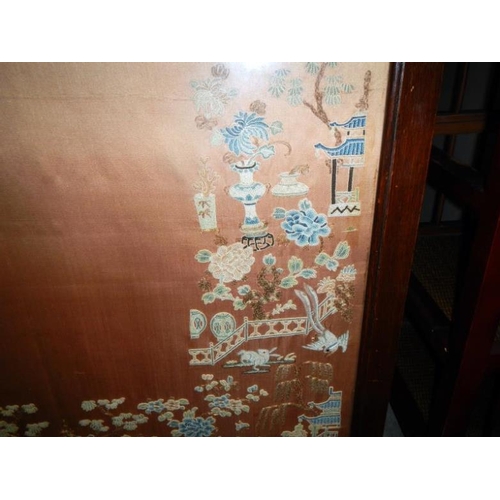 52 - A fire screen with a Chinese silk panel