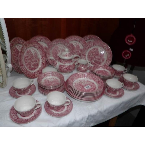 597 - A quantity of pink tea and dinner ware