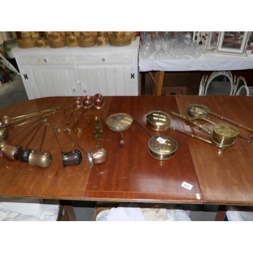 608 - A mixed lot of brass chestnut roasters, measures etc