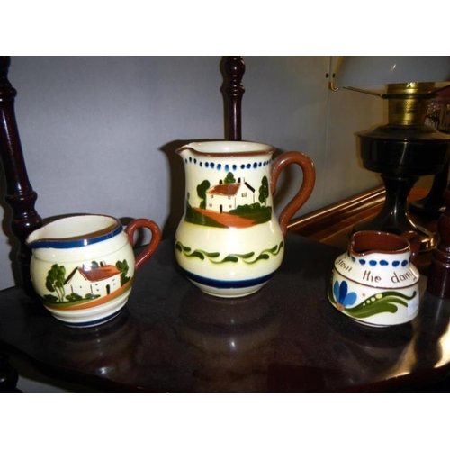 61 - 10 items of Devon 'mottoware' including jugs & teapot etc