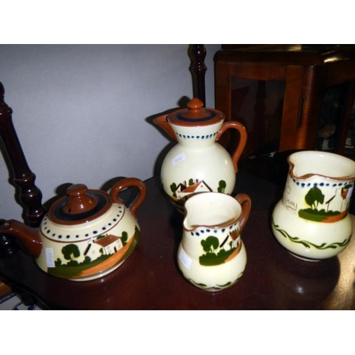 61 - 10 items of Devon 'mottoware' including jugs & teapot etc