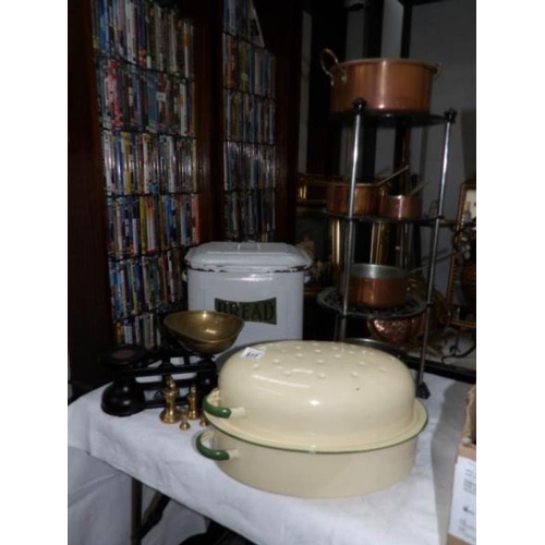 611 - A mixed lot including scales, pan stand, copper pans, enamel bread bin and enamel roaster