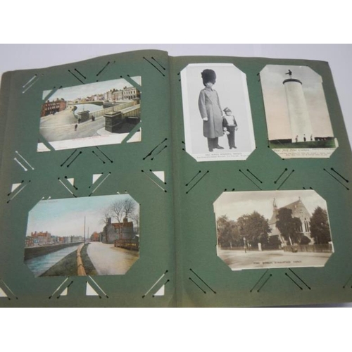 209 - Postcards - An album of early postcards, topgraphical, comic, military, railway etc