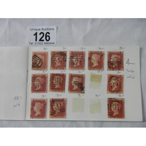 126 - Stamps - A booklet containing over 100 Victorian British Penny Red stamps and a packet of over 50 lo... 