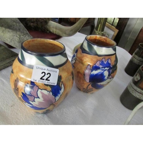 22 - A pair of hand painted arts and crafts vases, Minster by H & K Tunstall