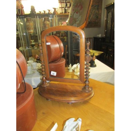 58 - A small mahogany toilet mirror