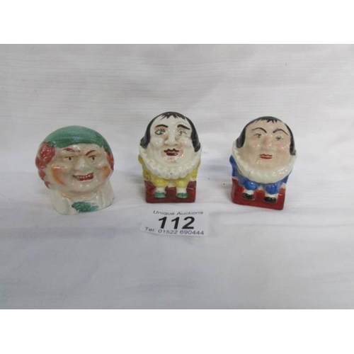 112 - A pair of hand painted Humpty Dumpty salt and pepper pots together with a small money box