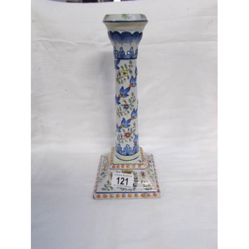 121 - A continental porcelain candle stick