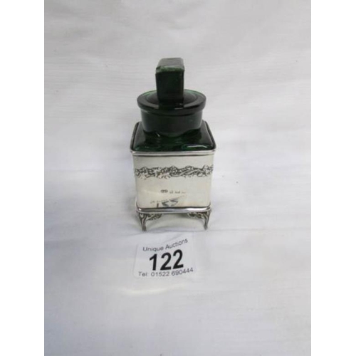 122 - An unusual green glass chemist's bottle in a HM silver holder (silver 53g)