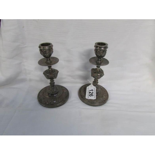 126 - A pair of silver plated candlesticks by Elkington & Co.,