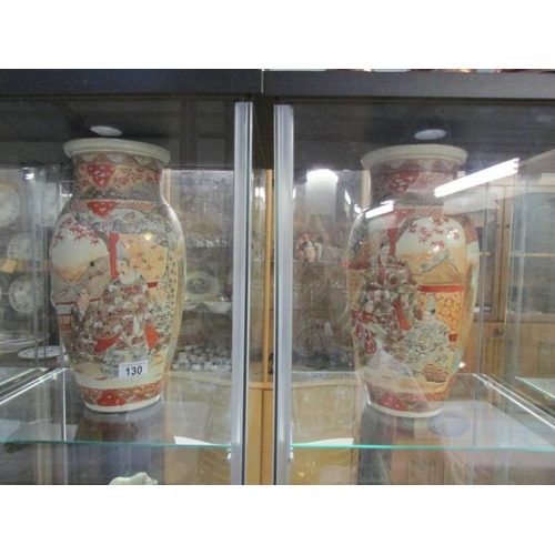 130 - A pair of large hand decorated oriental vases (a/f)