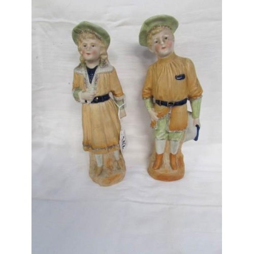 142 - A pair of continental bisque figures