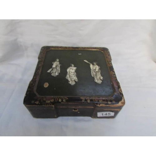 145 - A fine Japanese lacquer box inlaid with ivory figures (some wear to lacquer)