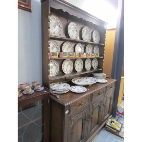 154 - A good quality Priory style oak dresser