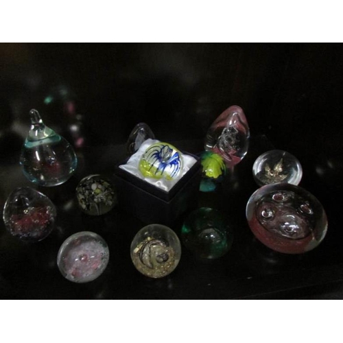 176 - 25 assorted glass paperweights