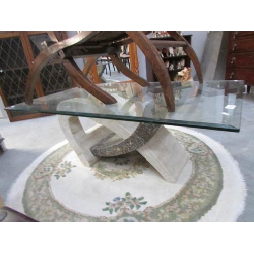 219 - An art deco style glass topped coffee table