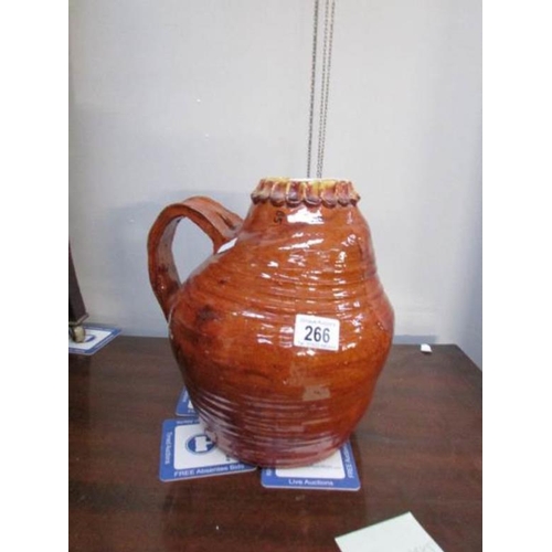 266 - A large stoneware jug decorated with treacle glaze