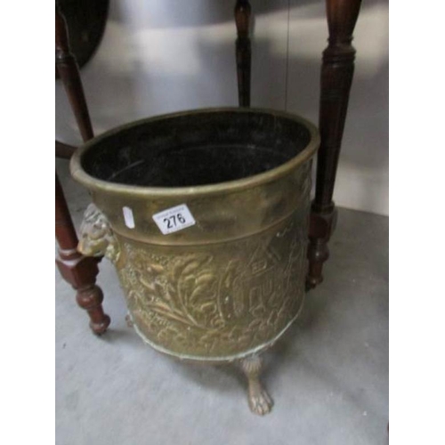 276 - A late Victorian embosses brass log bin