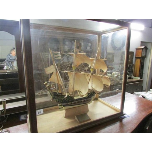 66 - A model galleon in glass case