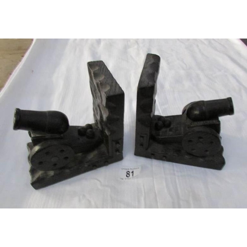 81 - A pair of carved wood bookends in the shape of cannons