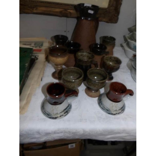 303 - A stoneware jug and other stoneware items