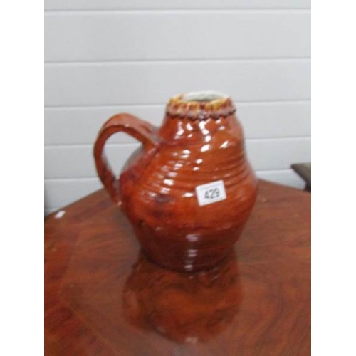 429 - A treacle glazed art pottery jug