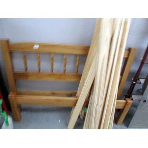 9 - A pine bedstead complete with slats