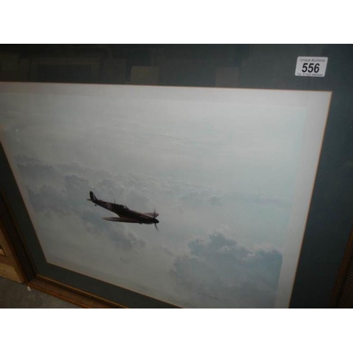 556 - A framed and glazed signed Gerald Coulson print entitled 'Solitude', a Vicker's Supermarine Spitfire... 