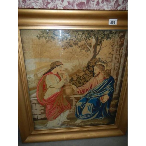 566 - A framed and glazed religious tapestry, image 52 x 60 cm