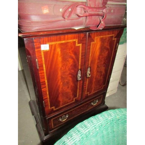 33 - A mahogany effect TV cabinet