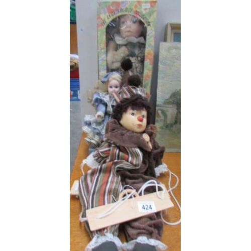 424 - 2 porcelain dolls and a clown doll