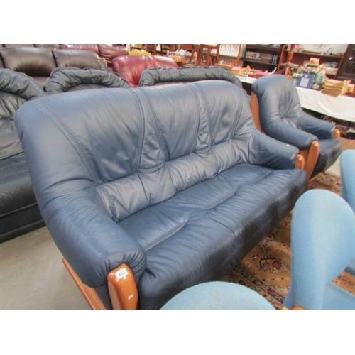 430 - A blue leather sofa and chair