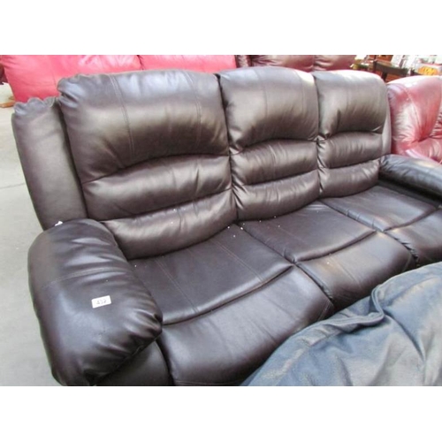 432 - A nearly new black leather sofa