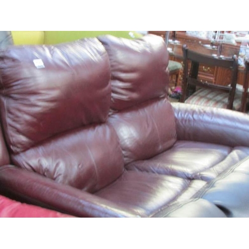 434 - A brown leather sofa