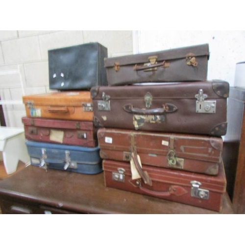 69 - 8 vintage suitcases including some with labels