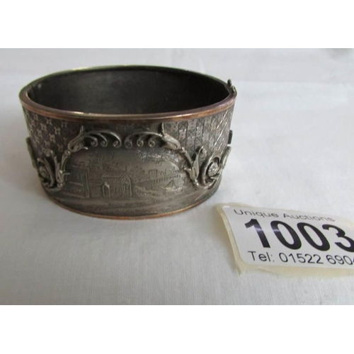 1003 - An engraved white and yellow metal bangle