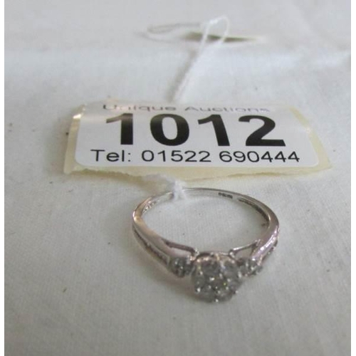 1012 - An 18ct white gold floral ring, size L