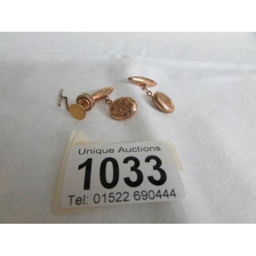 1033 - A pair of 9ct gold cuff links hall marked Chester 1894 and a 9ct gold tie tack