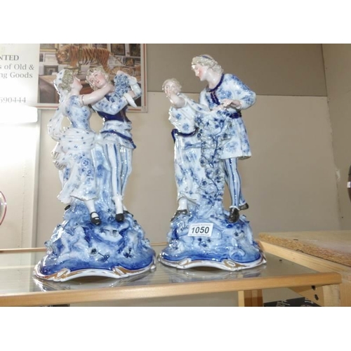 1050 - A pair of blue and white German figure groups, possibly Sitzendorf